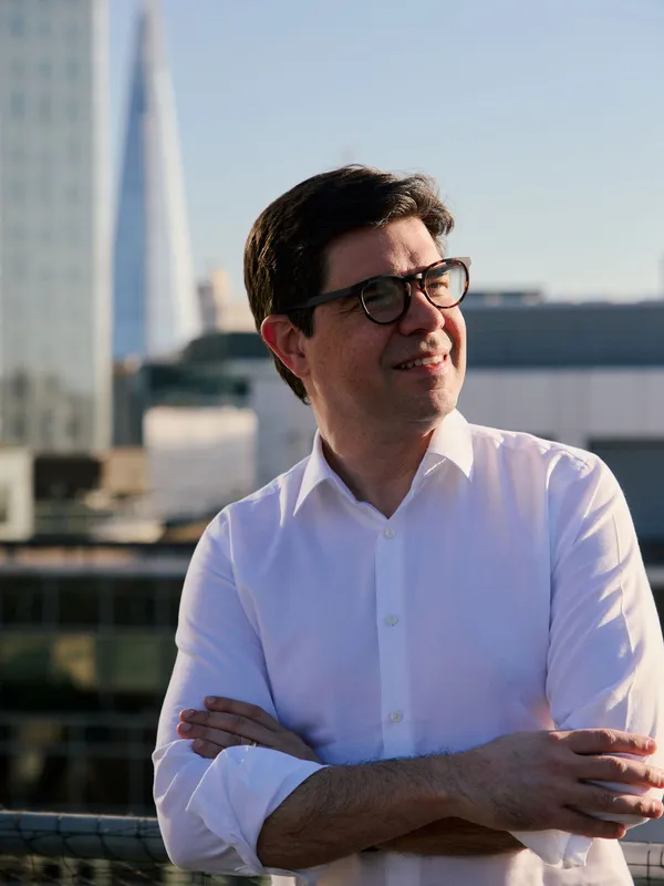 Bruno Genovese on a London rooftop, The Shard visible in the background
